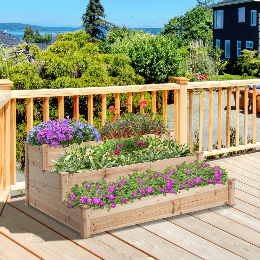 3-lags højbed i naturtræ på terrasse med farverige blomster og udsigt