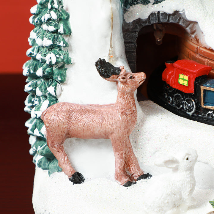 Snemandsformet julelandsby med kørende tog, led-lys og musik, festlig borddekoration, flerfarvet