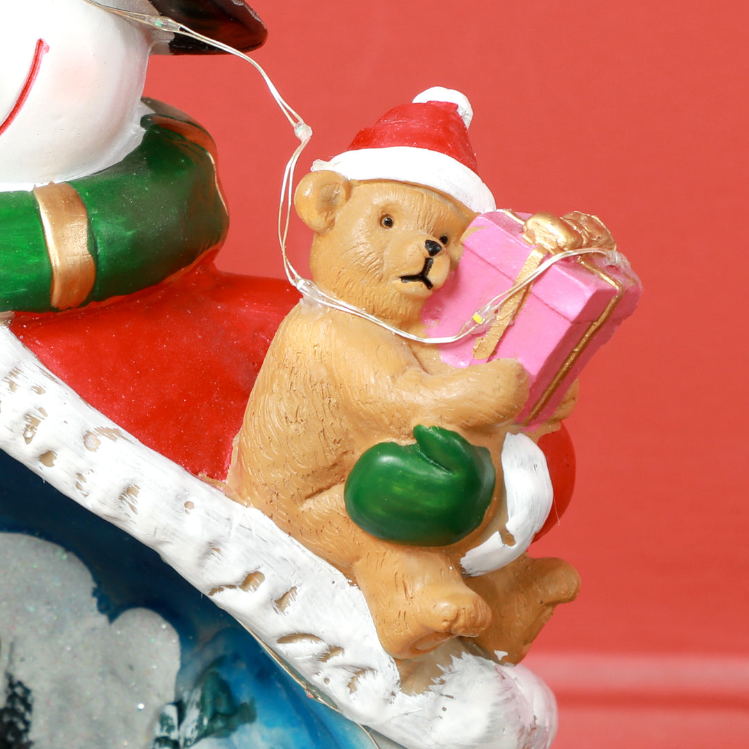 Snemandsformet julelandsby med kørende tog, led-lys og musik, festlig borddekoration, flerfarvet