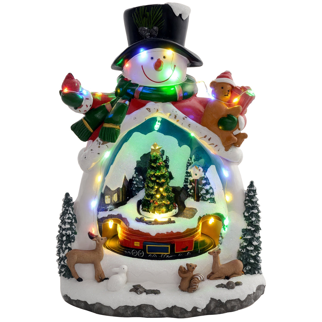 Snemandsformet julelandsby med kørende tog, led-lys og musik, festlig borddekoration, flerfarvet