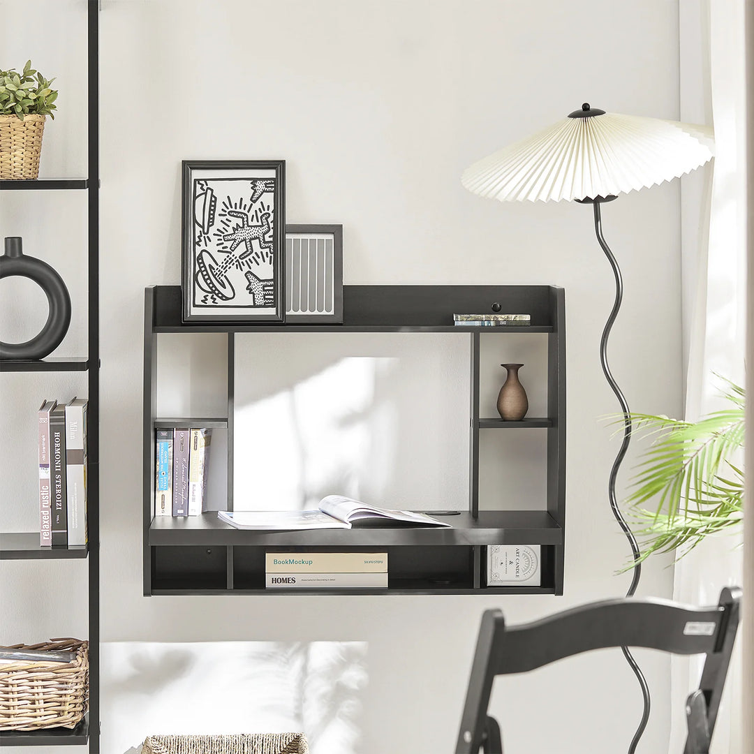 Udnyt pladsen optimalt med dette pladsbesparende skrivebord i sort (B64 x D58 x H82 cm)