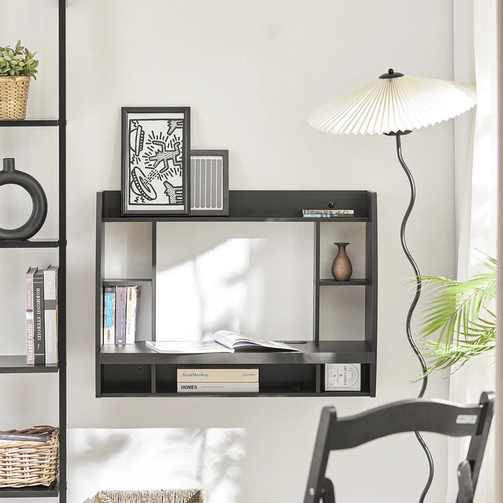 Udnyt pladsen optimalt med dette pladsbesparende skrivebord i sort (B64 x D58 x H82 cm)