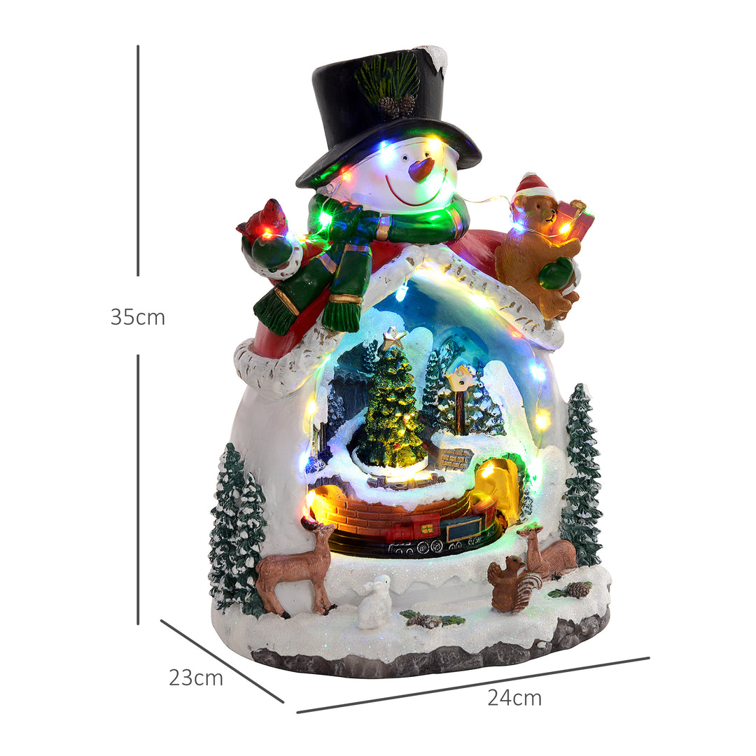 Snemandsformet julelandsby med kørende tog, led-lys og musik, festlig borddekoration, flerfarvet