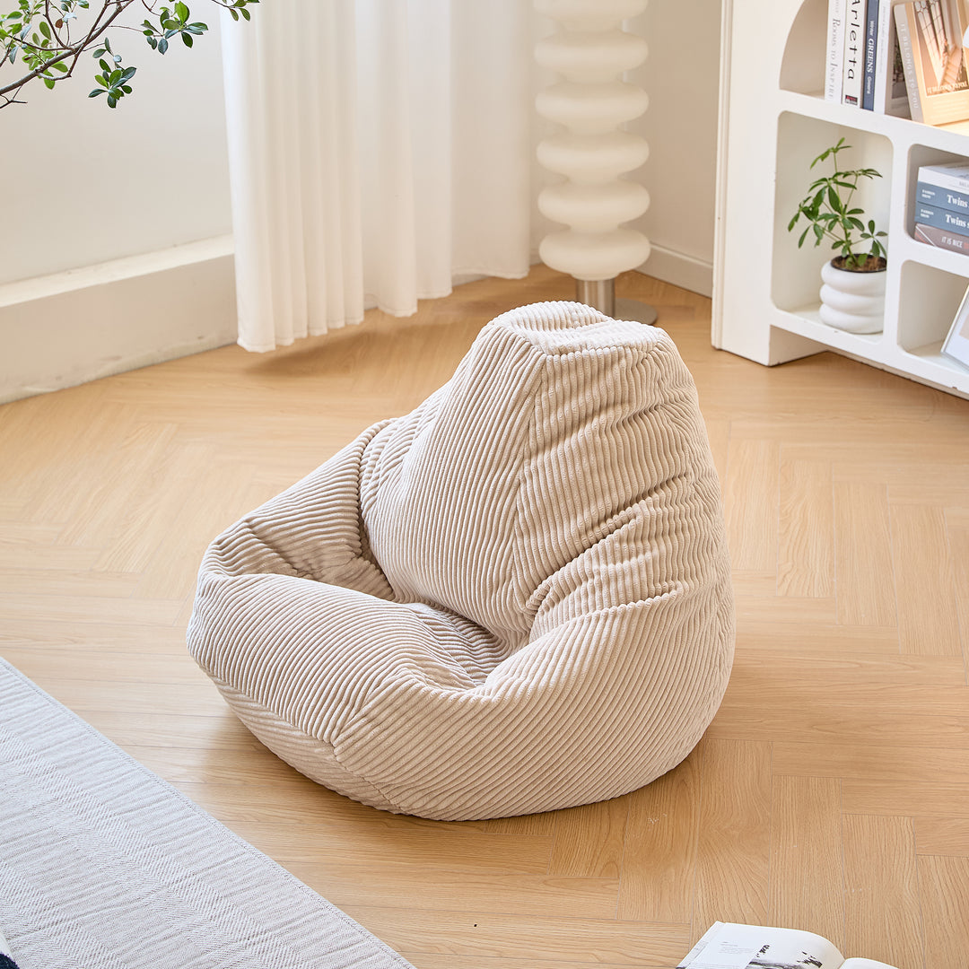 GRANA Beige fløjlsbøjlepuf til stuen
