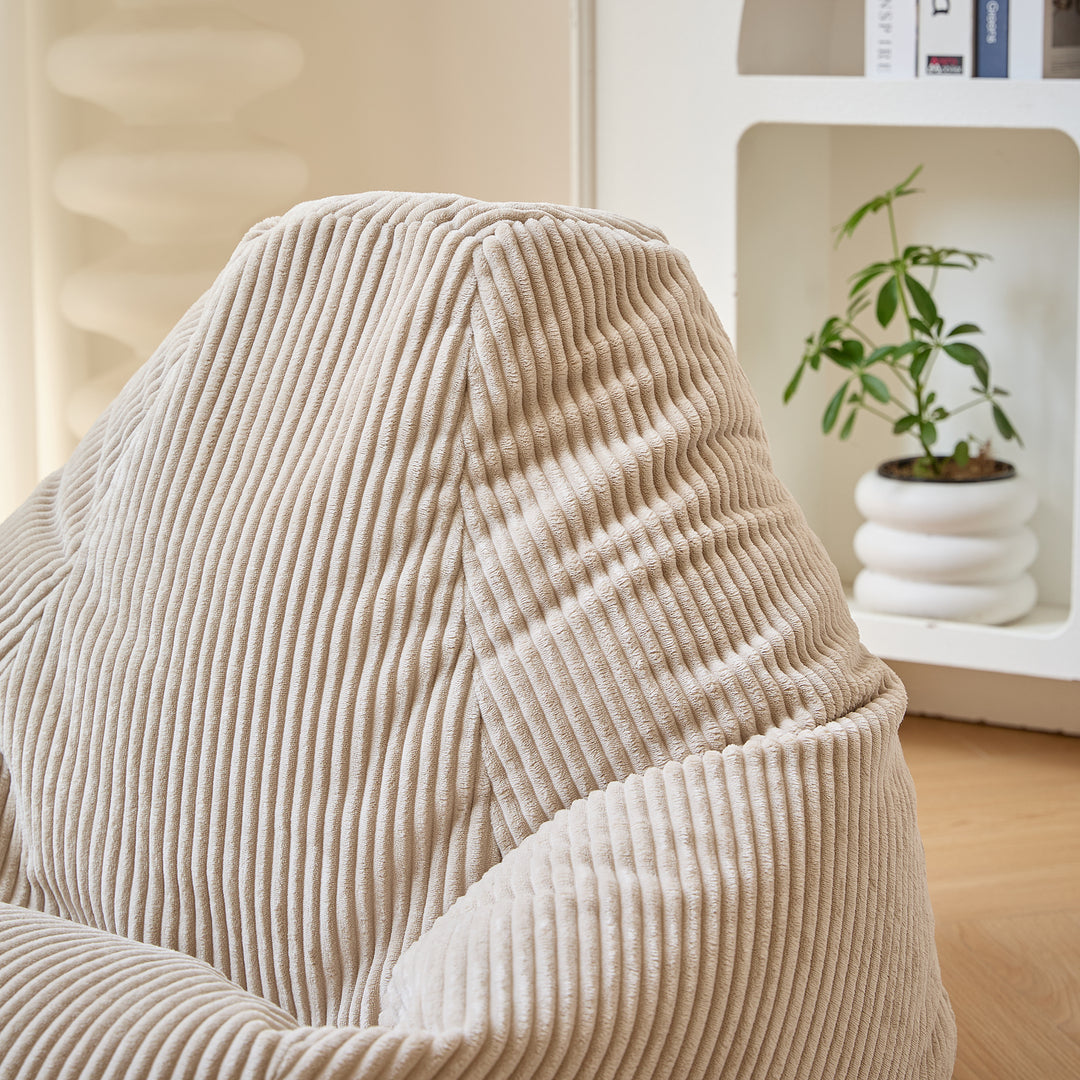 GRANA Beige fløjlsbøjlepuf til stuen