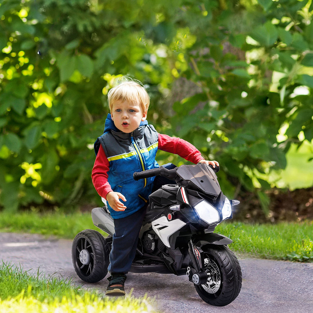 Elektrisk børnemotorcykel, lys og lyd, 3 km/t, genopladelig, plast og metal, sort/hvid