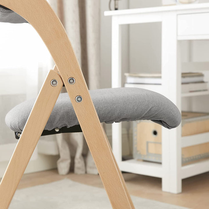 Træfoldestol med polstret sæde og ryglænd