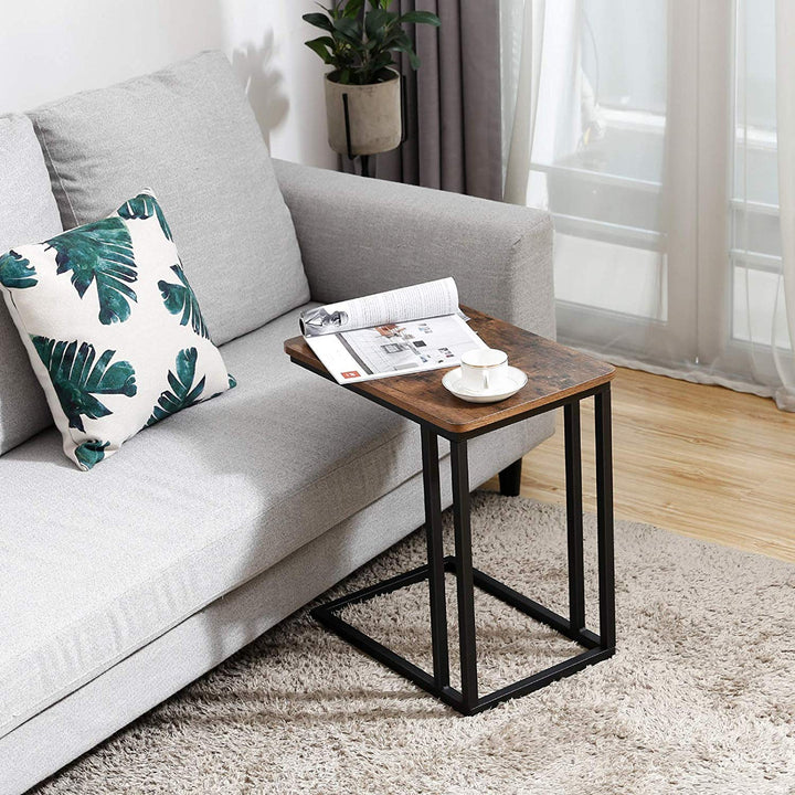 a living room filled with furniture and a window 