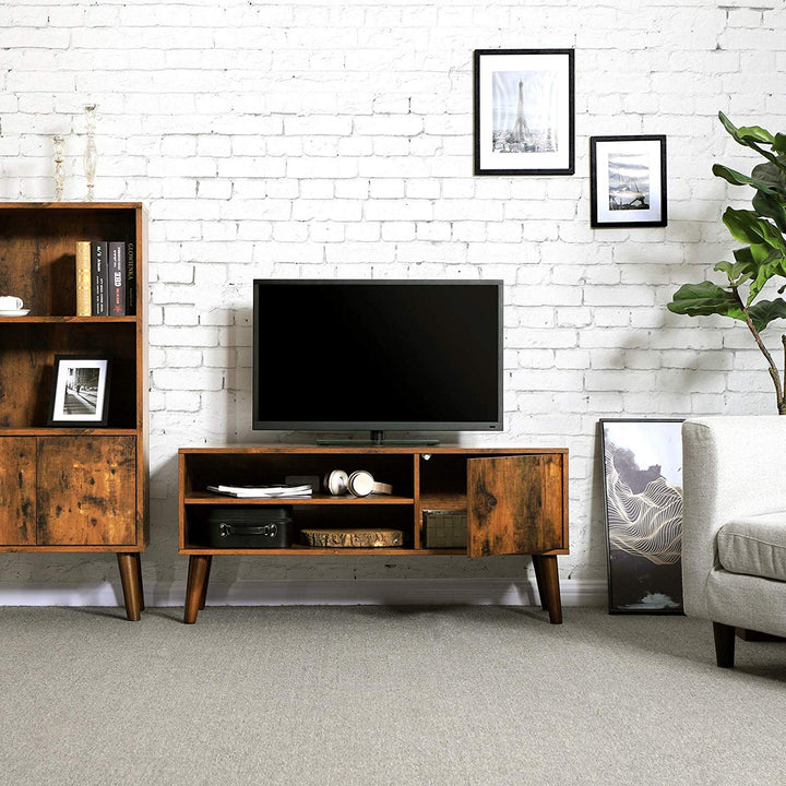 a living room filled with furniture and a flat screen tv 