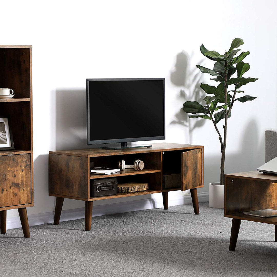 a living room filled with furniture and a flat screen tv 