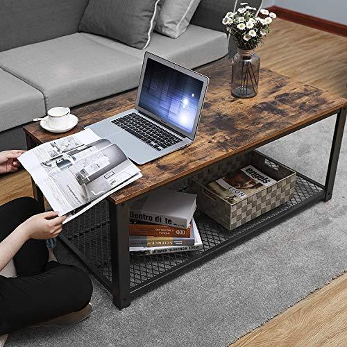 a laptop computer sitting on top of a wooden table 